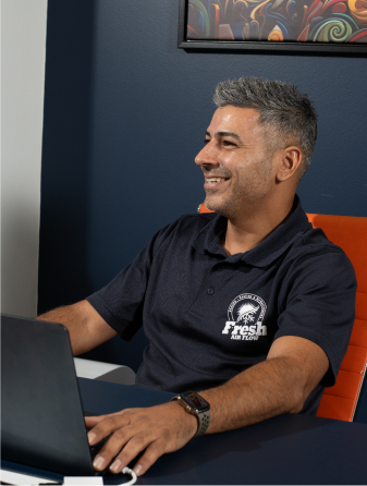 Employee sitting at a computer