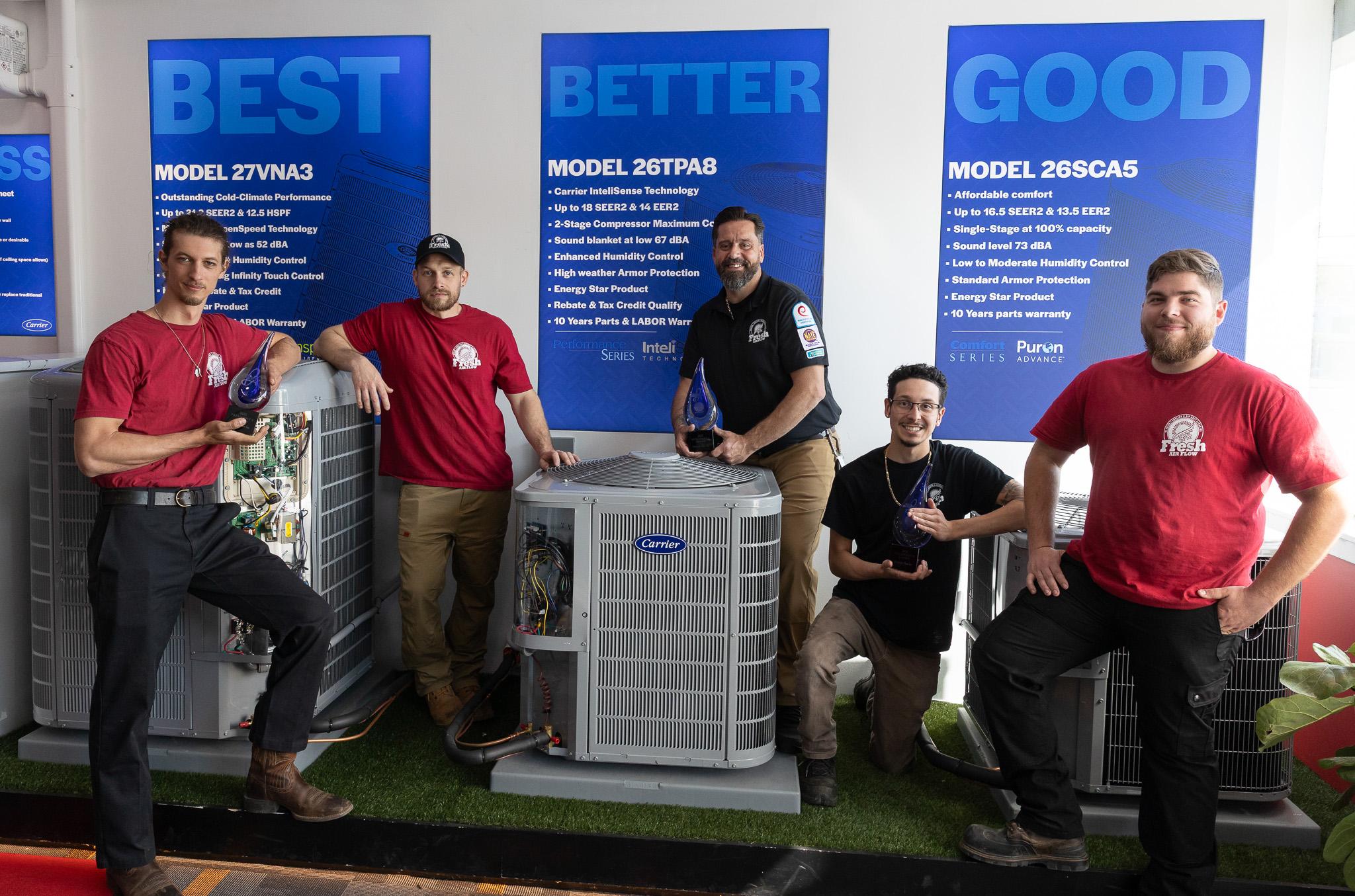 Fresh Air Flow team in front of the Carrier showroom display in Cherry Hill