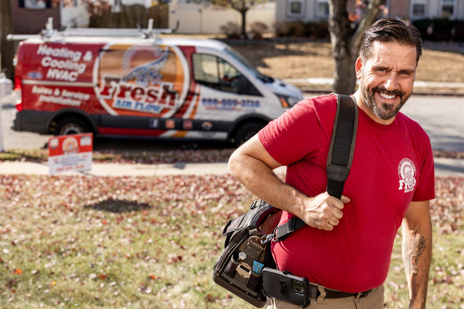 Fresh Air Flow HVAC owner in branded red hoodie