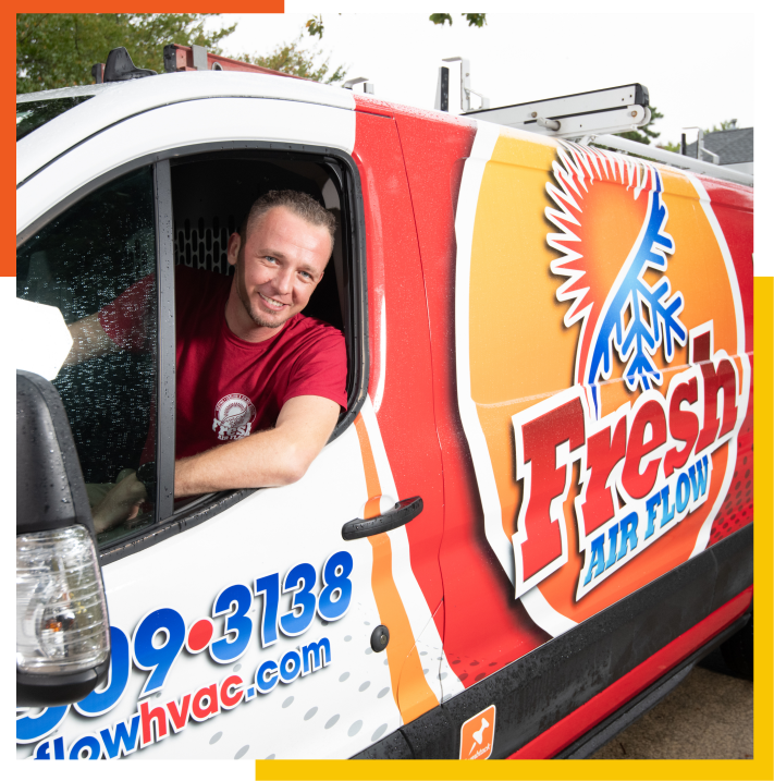 Man smiling driving Fresh Air Flow van